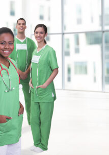 Portait of a young female doctor and her successful team